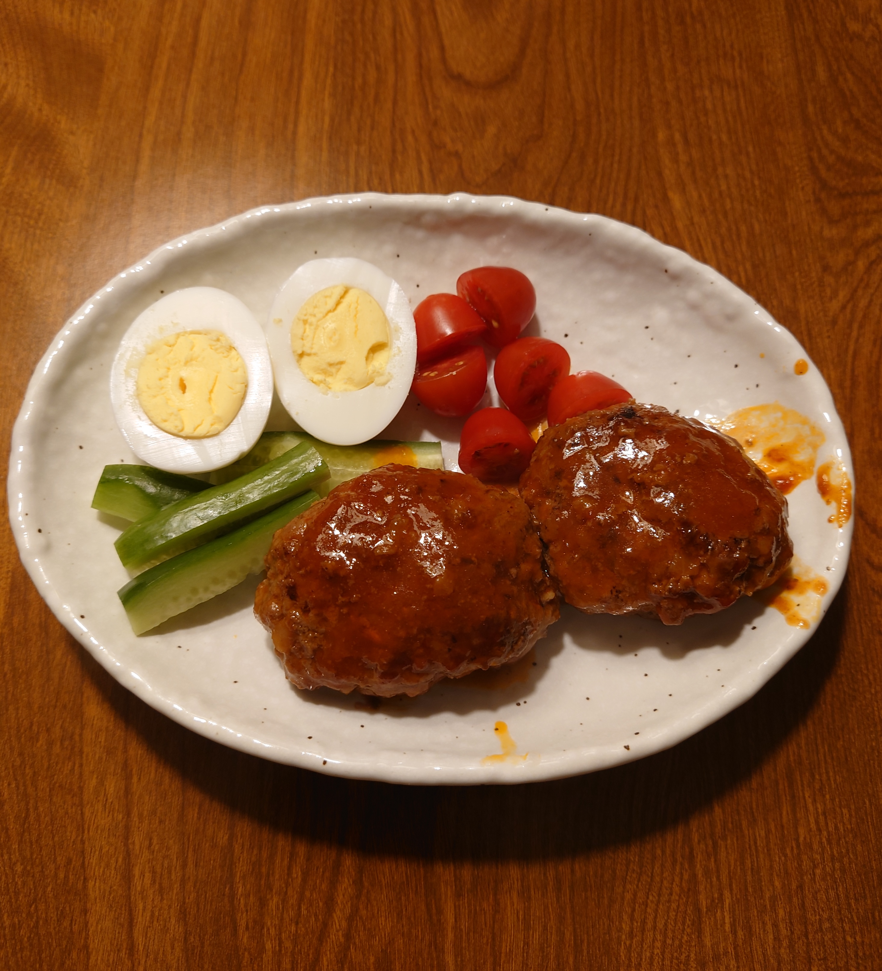 2 stewed hamburger steaks served in a dish