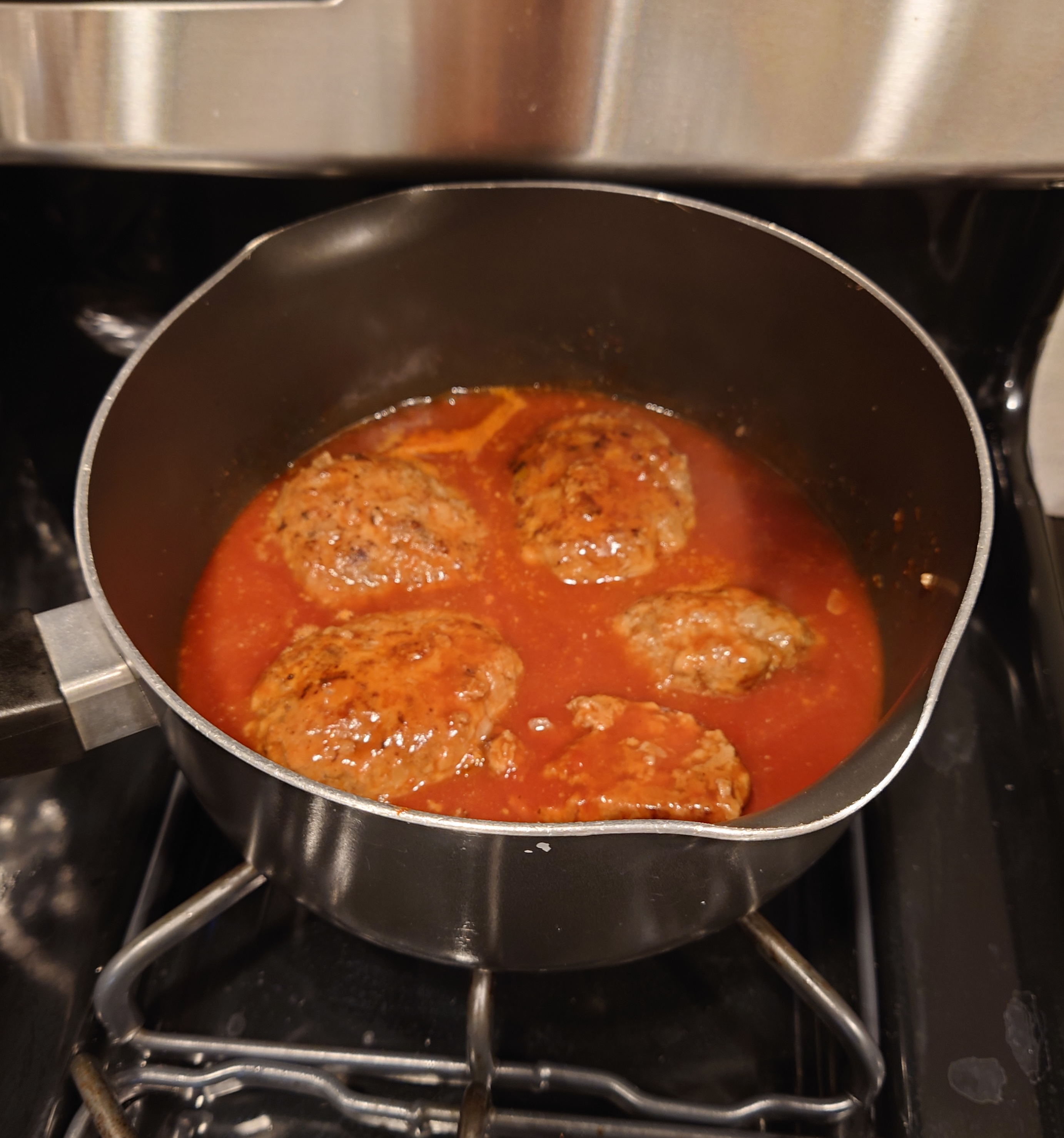 Stewed hamburger steaks in the pot